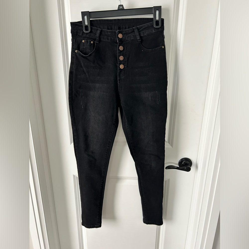 Shein black skinny, multi button black jeans.